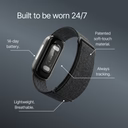 Image of the Band 2.0 fitness tracker on a dark background with the heading 'Built to be worn 24/7.' Labeled callouts point to different features: '14-day battery,' 'Patented soft-touch material,' 'Always tracking,' and 'Lightweight, breathable' strap.
