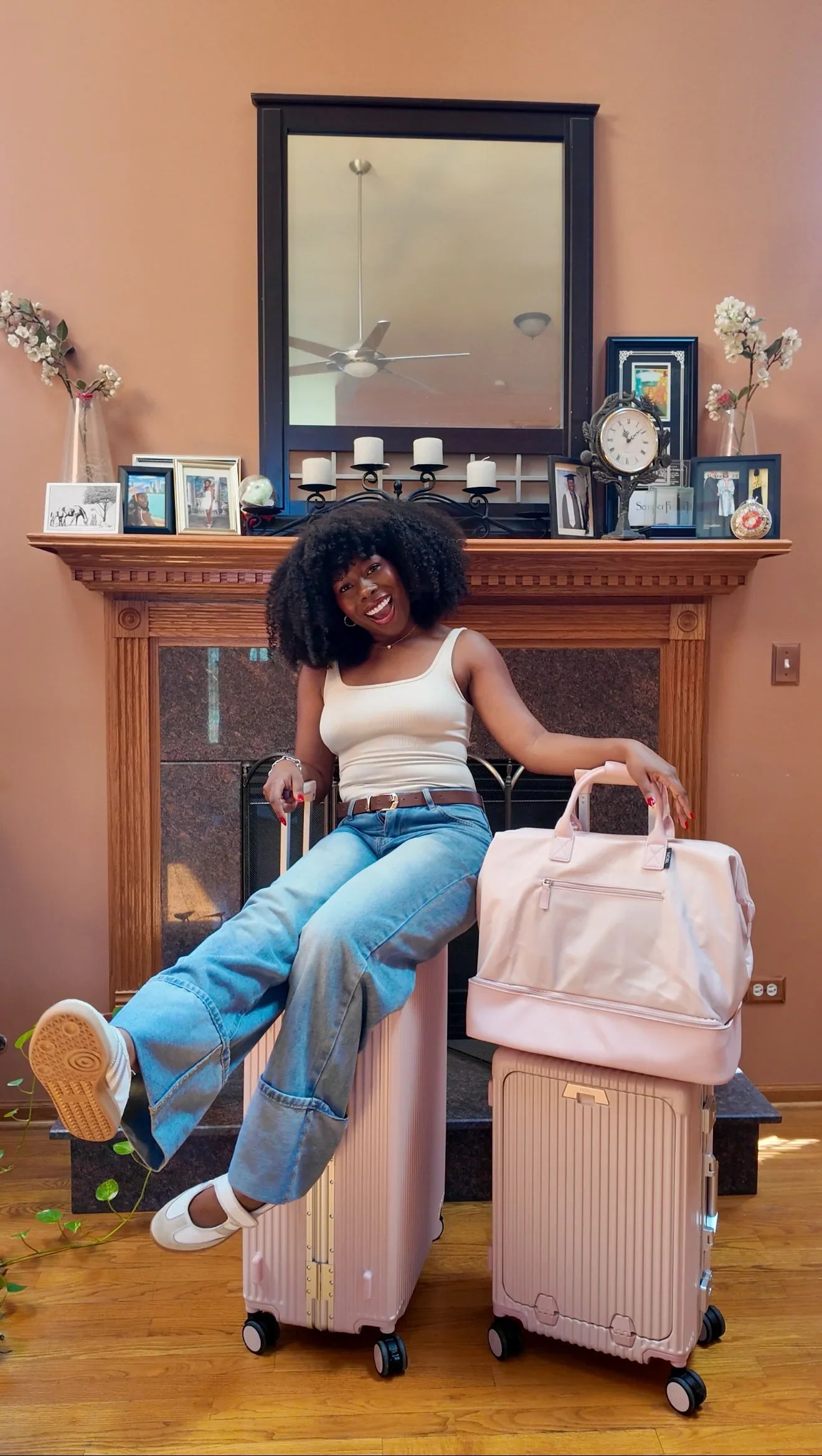 Woman traveling with rose-gold luggage